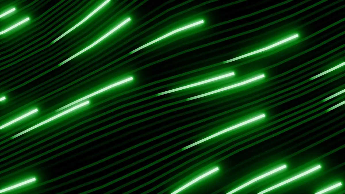 Haces de luz verde en movimiento sobre fondo negro